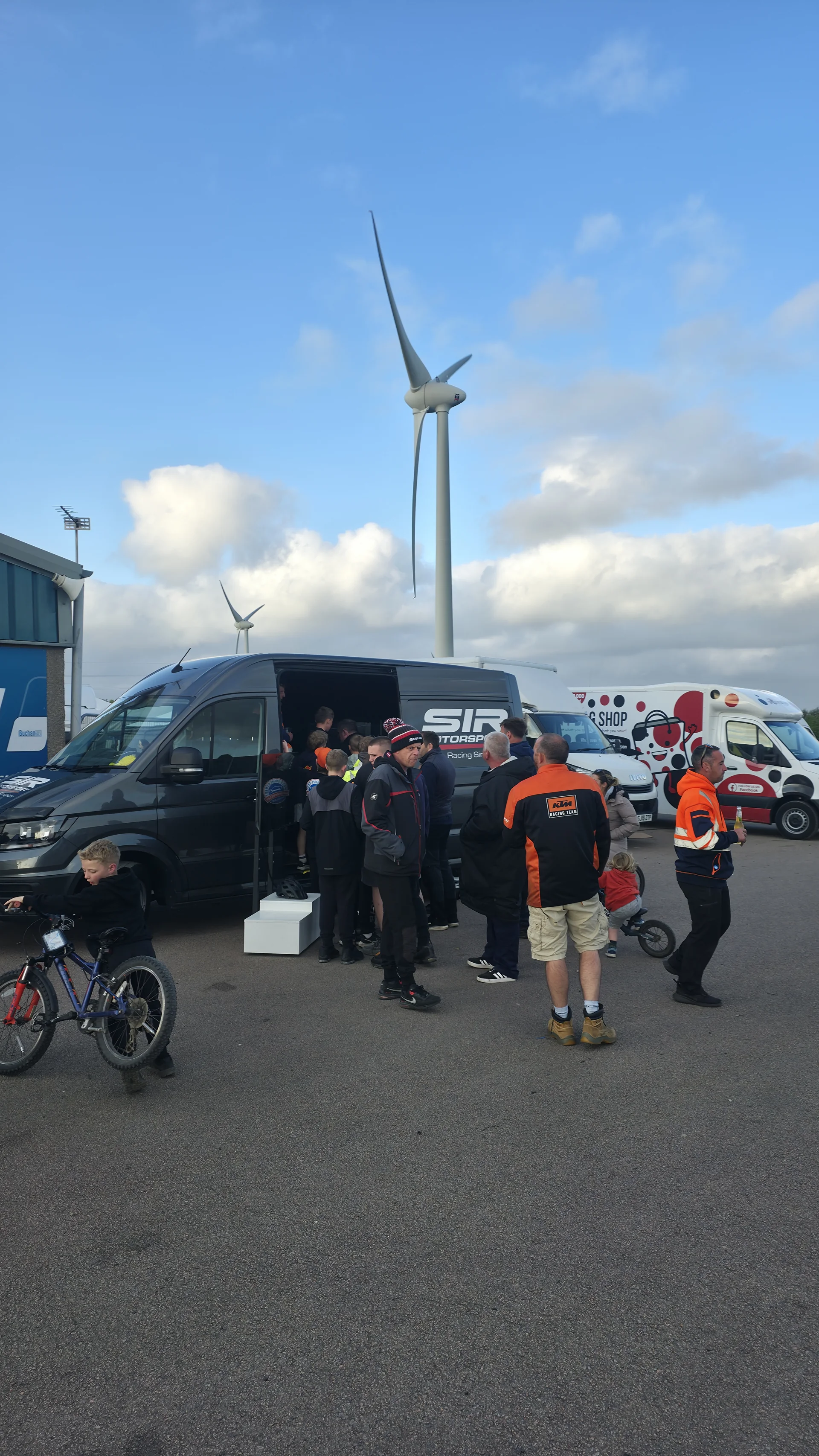 Visitors gathered at the SIR Motorsport simulator