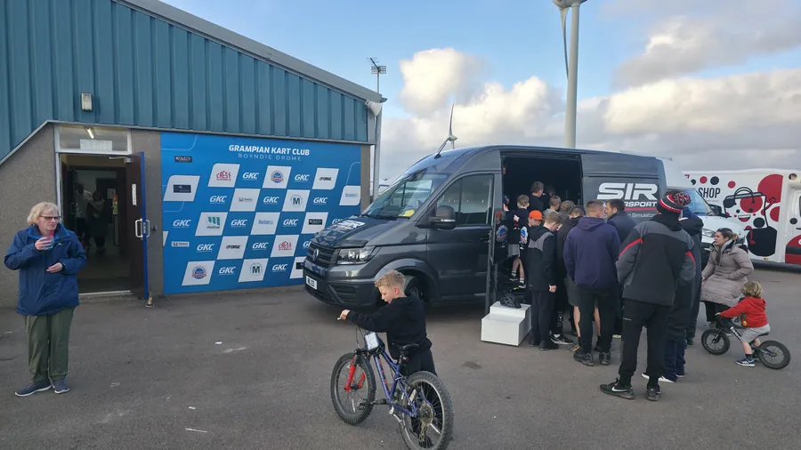 Visitors queueing for the SIR Motorsport simulator at Grampian Kart Club