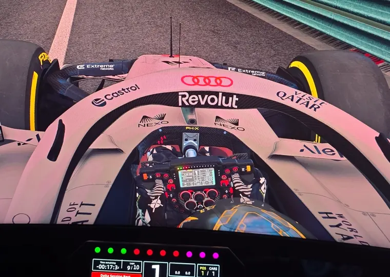 Onboard F1 racing view from the SIR Motorsport simulator screens.