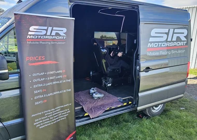 SIR Motorsport simulator van entrance with branded service banner.